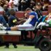 Injured New York Giants player on a medical cart.