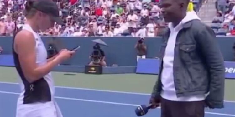 Polish tennis player Iga Swiatek delayed her post match interview to send a text message to her coach after defeating Russia's Ekaterina Alexandrova, 6-3, 6-1, in Round 4 of the 2025 US Open on Monday, September 1, 2025.