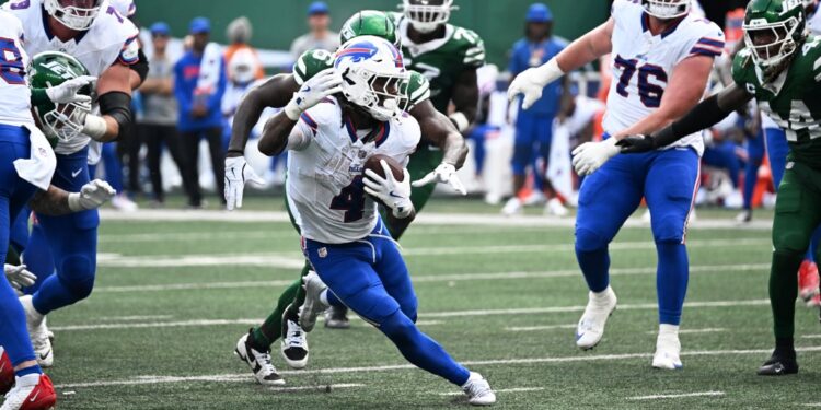 James Cook runs with the ball during the Bills-Jets game on Sept. 14, 2025.