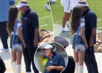 Jordon Hudson chats with Bill Belichick before North Carolina's loss to UCF