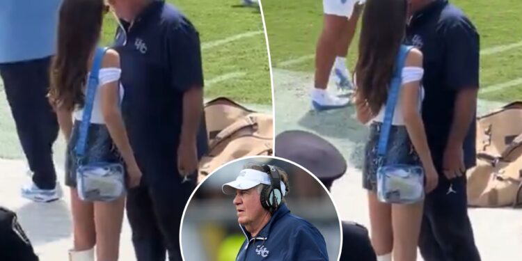Jordon Hudson chats with Bill Belichick before North Carolina's loss to UCF