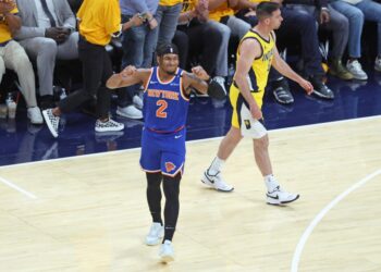 Miles McBride of the New York Knicks reacts after a missed three-point shot.