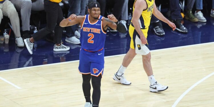 Miles McBride of the New York Knicks reacts after a missed three-point shot.