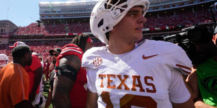 Arch Manning, Texas Longhorns quarterback #16, leaving the field.