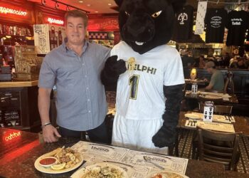 Vincent's Clam Bar owner with the Adelphi University mascot.