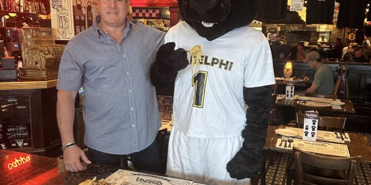 Vincent's Clam Bar owner with the Adelphi University mascot.