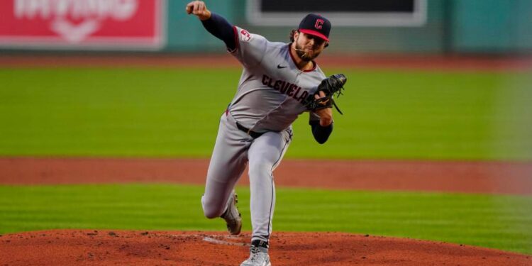 Cleveland Guardians pitcher throwing a baseball.