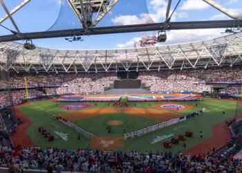 New York Mets and Philadelphia Phillies lineup on the field during the pre-game ceremonies.