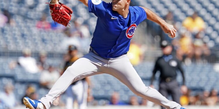 Cubs pitcher in mid-throw.