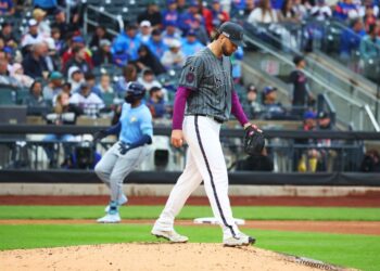 New York Mets pitcher Tylor Megill walking off the mound.