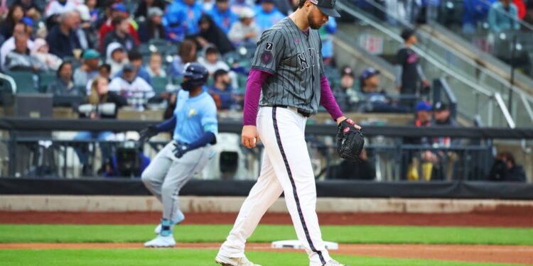 New York Mets pitcher Tylor Megill walking off the mound.