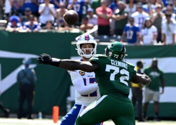 Micheal Clemons hits Josh Allen -- drawing a roughing the passer penalty -- during the Jets-Bills game on Sept. 14, 2025.