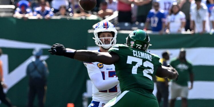 Micheal Clemons hits Josh Allen -- drawing a roughing the passer penalty -- during the Jets-Bills game on Sept. 14, 2025.