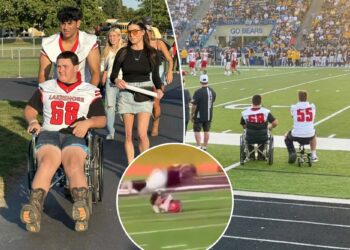 Michigan high school football player Colton Mims reunites with teammates after opponent fractured his spine