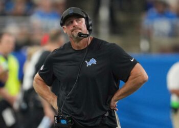 Lions coach Dan Campbell on the sidelines during a football game.
