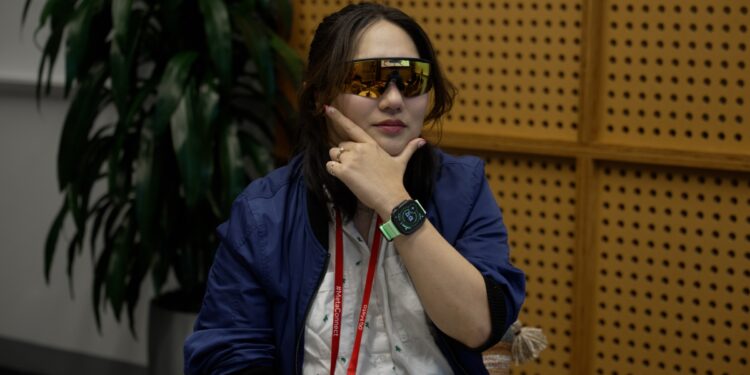 Photo of Senior Reviewer Victoria Song wearing the Oakley Meta Vanguard and looking like an absolute jabroni in the pose.