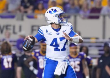 Brigham Young Cougars quarterback Bear Bachmeier (47) throws the ball against the East Carolina Pirates.
