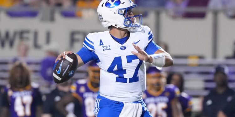 Brigham Young Cougars quarterback Bear Bachmeier (47) throws the ball against the East Carolina Pirates.