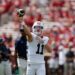 Auburn quarterback Jackson Arnold (11) warms up during a college football game.
