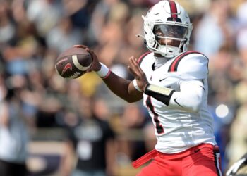 Ball State Cardinals quarterback Kiael Kelly throwing a football.