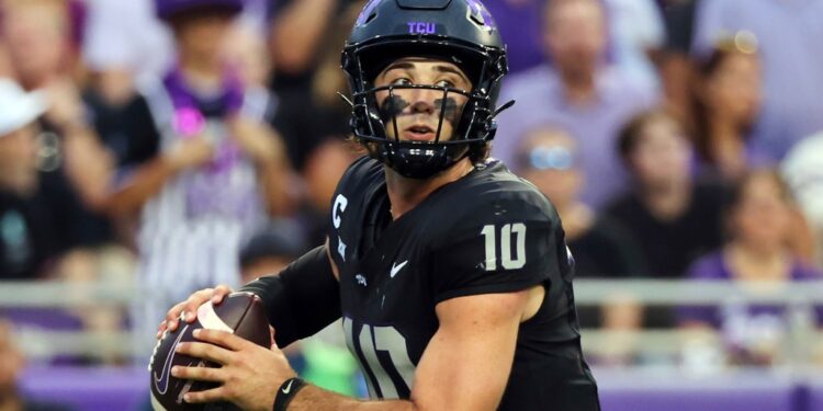 Josh Hoover, TCU quarterback, holding a football.