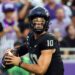 Josh Hoover, TCU quarterback, holding a football.