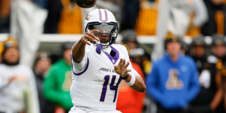 Alonza Barnett III, James Madison quarterback, throwing a football.