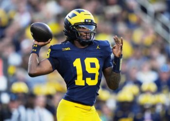 Michigan quarterback Bryce Underwood throwing a football.