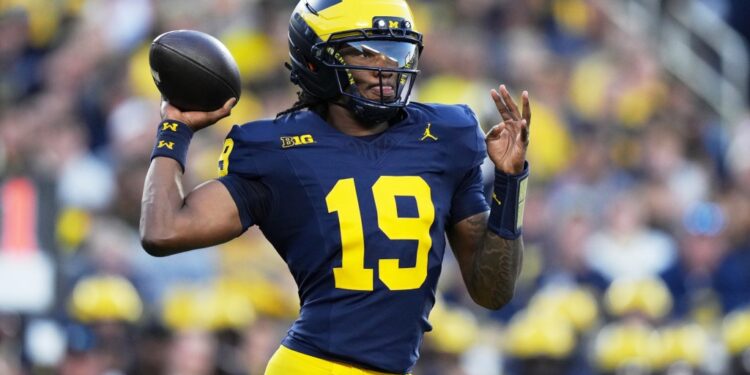 Michigan quarterback Bryce Underwood throwing a football.