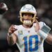 Justin Herbert, Los Angeles Chargers quarterback, throwing a football.