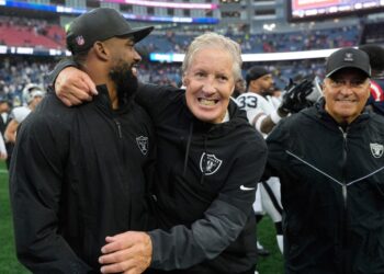 Las Vegas Raiders coaches celebrating after a game.