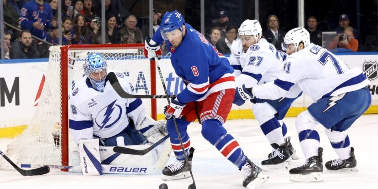 Tampa Bay Lightning goalie Andrei Vasilevskiy defending the net against New York Rangers.