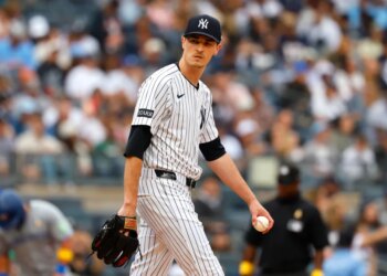 New York Yankees pitcher Max Fried (54) pauses before pitching against the Toronto Blue Jays.