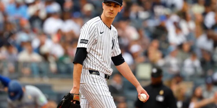 New York Yankees pitcher Max Fried (54) pauses before pitching against the Toronto Blue Jays.