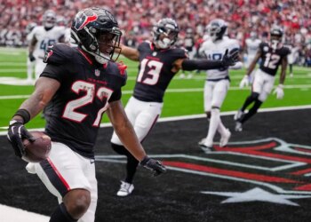Houston Texans running back Woody Marks (27) celebrates his touchdown.