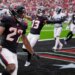 Houston Texans running back Woody Marks (27) celebrates his touchdown.