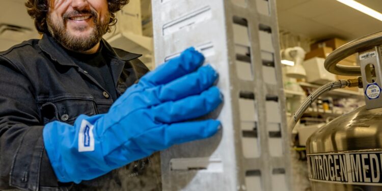 Ben Lamb holding a rack of samples in liquid nitrogen.