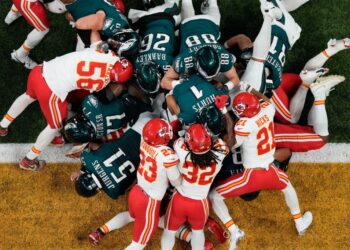 Philadelphia Eagles quarterback Jalen Hurts (1), with help of the tush push from teammates, scores a touchdown against the Kansas City Chiefs during the first half of the NFL Super Bowl 59 football game, Sunday, Feb. 9, 2025, in New Orleans.