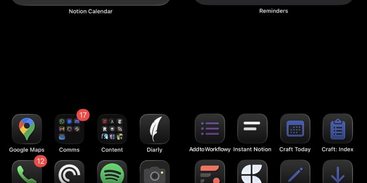 An iPhone homescreen with a black background,