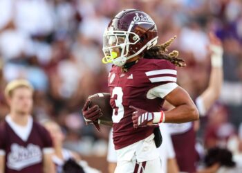 Mississippi State Bulldogs wide receiver Anthony Evans III (3) scores a touchdown during the first half.