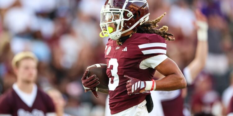 Mississippi State Bulldogs wide receiver Anthony Evans III (3) scores a touchdown during the first half.