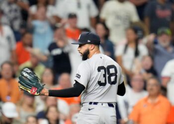 Devin Williams, New York Yankees pitcher #38, walking off the field.