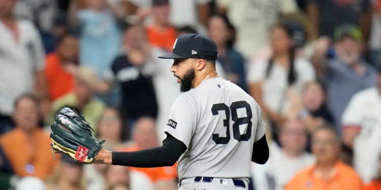 Devin Williams, New York Yankees pitcher #38, walking off the field.