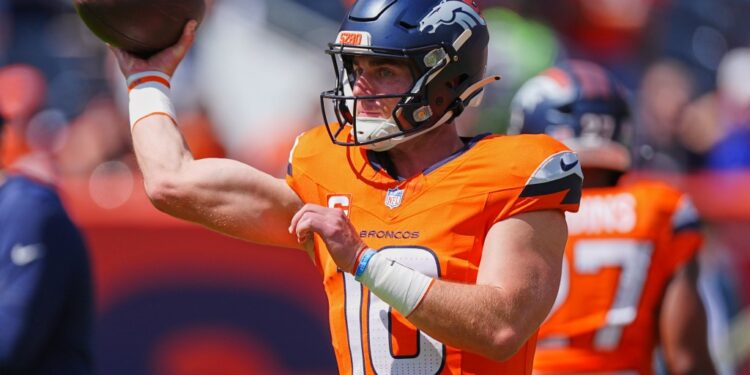 Denver Broncos quarterback throwing a football.