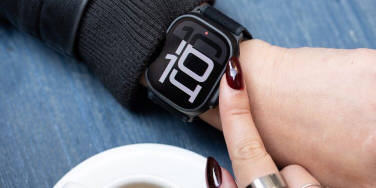 Close up of person looking at Black Apple Watch Ultra 2