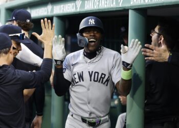 A smiling Jazz Chisholm celebrates with teammates in the dugout after hitting a solo home run in the fifth inning of the Yankees' 5-3 win over the Red Sox on Sept. 13, 2025 at Fenway Park.