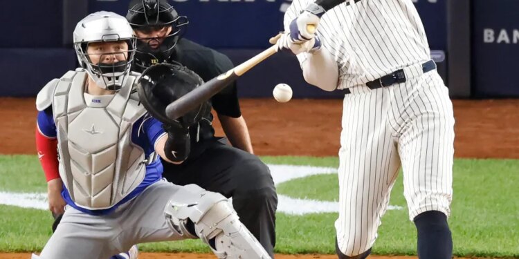 Aaron Judge hits a three-run home run during the Yankees' Game 3 win over the Blue Jays on Oct. 7, 2025.