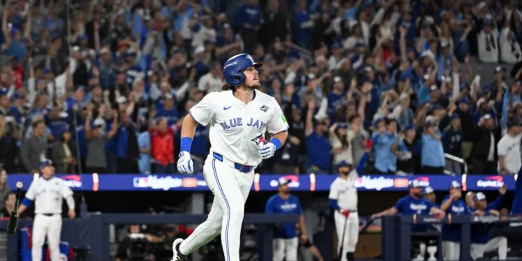 Toronto Blue Jays right fielder Addison Barger (47) rounds the bases after hitting a grand slam against the Los Angeles Dodgers in the sixth inning during game one of the 2025 MLB World Series at Rogers Centre.