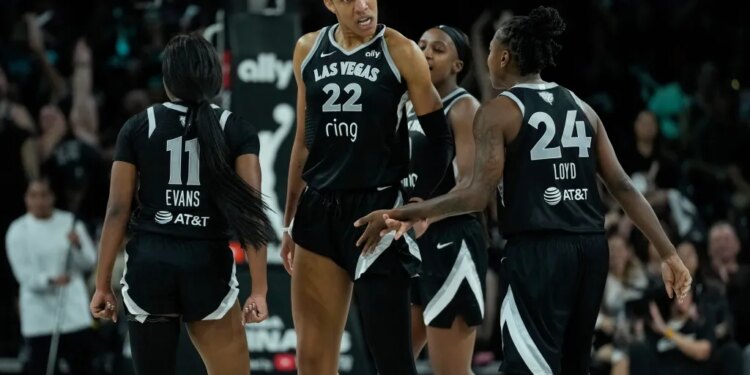 Las Vegas Aces center A'ja Wilson (22) celebrates with teammates.