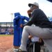 New York Yankees hitting coach James Rowson in the dugout during a game.